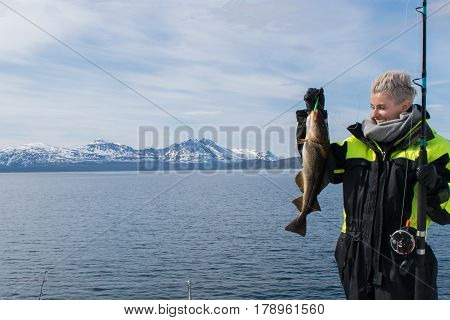 Girl at fishing trip in Tromso inside the artic circle