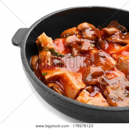 Chicken cacciatore in frying pan isolated on white