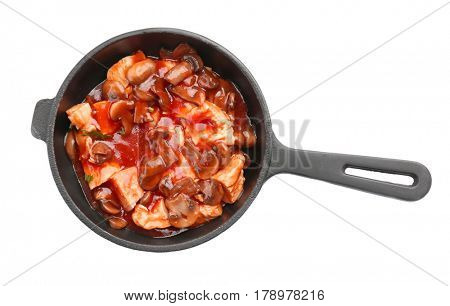 Chicken cacciatore in frying pan isolated on white