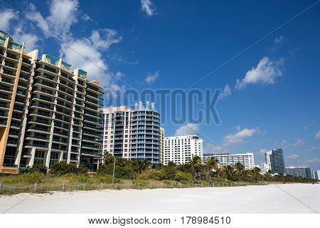 Hotels and condominiums line the white sandy Miami South Beach Florida USA.