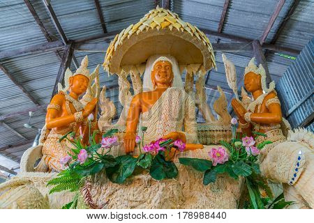 Buddha image with Thai literature goddess made from wax for marhing in candle festival in Ubonratchthani Thailand