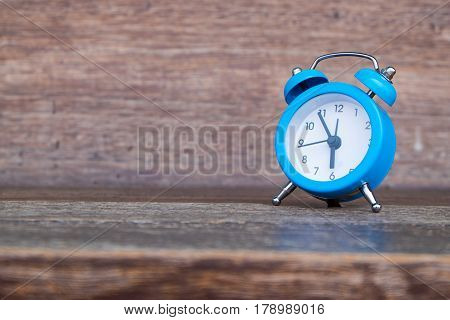 classic blue alarm clock morning wake-up time