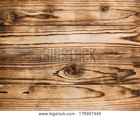 Horizontally disposed burnt wood boards with knots texture