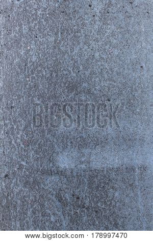 The fragment of concrete wall Surface. Vertically composed.
