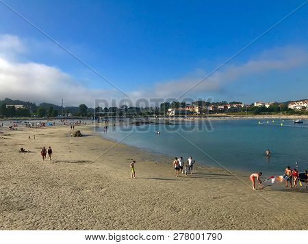 View Of A Typical Beach Day During A Sunny Summer In Sanxenxo Galicia Spain