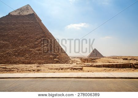 Pyramids Of Giza - Two Pyramids, View From Road On Blue Sky Background With Nobody