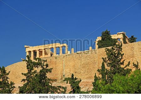 Looking Up At The Parthenon Above The Support Wall On The Acropolis In Athens, Greece With A Beautif