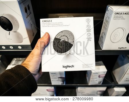 Paris, France - Oct 25, 2018: Man Holding In Apple Store The Packaging Of New Logitech Circle 2 Indo