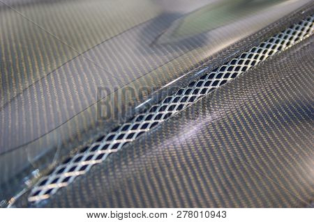 Black Carbon Car Hood Close Up. Tuning