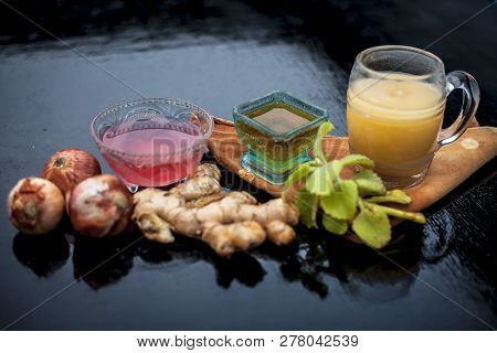 Close Up Of Hair Treatment For Loss Due To Lice On Wooden Surface I.e Onion And Ginger Juice Which H