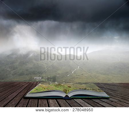 Landscape Image Of Low Cloud Hanging Over Snowdonia Mountain Range After Heavy Rainfall In Autumn Wi