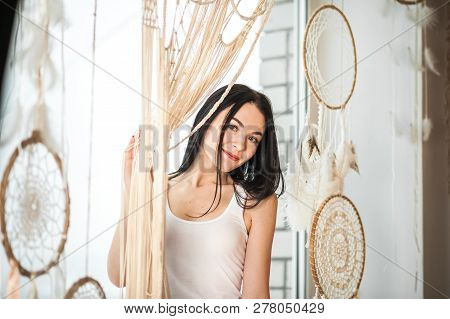 The Girl Weaves Macrame, Dream Catchers. Young Woman Hobby Weaving. Dream Catchers, Macrame On The W