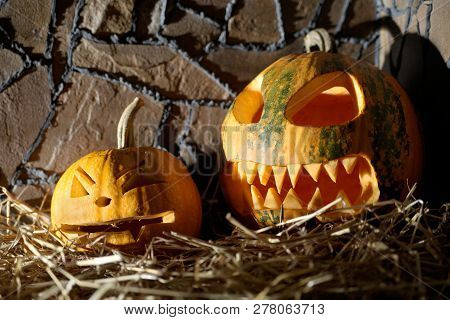 Pumpkin Face In Hay. Halloween Celebration. Two.