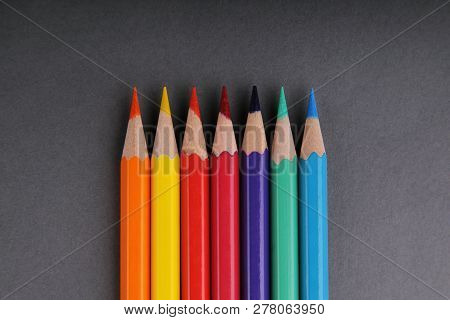Set Of Colored Pencils. Gray Background. Seven.