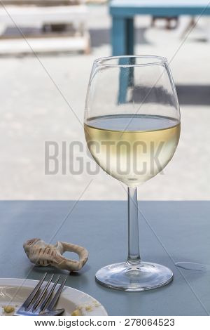Wine Glass With Chilled White Wine At Beach Restuarant Table At West Coast South Africa - Image