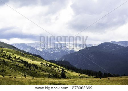 Landscape With Mountains, Green Hills And Cloudy Sky, Transalpina Road, Romania.
