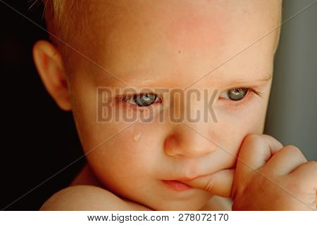 He Is A Cry Baby. Baby With Tear Rolling Down His Cheek. Little Baby Crying. Little Boy Child With S