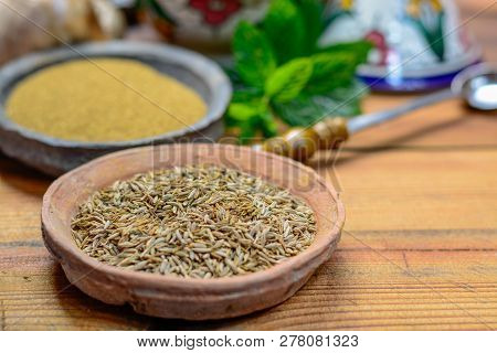 Old Clay Bowls With Cumin Seeds And Cumin Powder Close- Up, Spices Collection