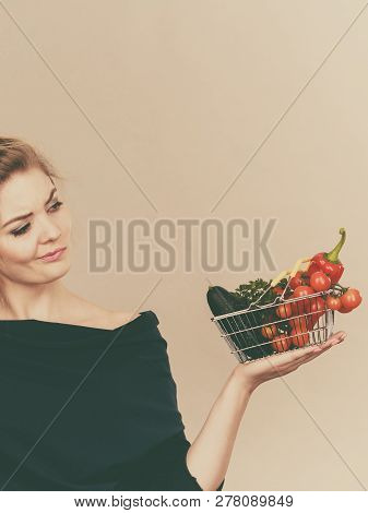 Adult Woman With Raw Food, Questioning Healthy Lifestyle Recommendations, Origin Vegetagles. Female 