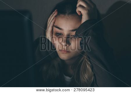 Teenager Girl Suffering Internet Cyber Bullying Scared And Depressed Cyberbullying. Image Of Despair