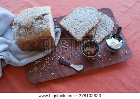 A Tasty And Healthy Breakfast In A Wooden Table Over A Brown Background