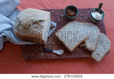 A Tasty And Healthy Breakfast In A Wooden Table Over A Brown Background
