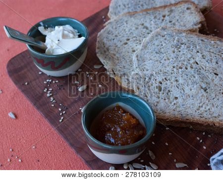 A Tasty And Healthy Breakfast In A Wooden Table Over A Brown Background