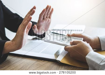 Anti Bribery And Corruption Concept, Business Man Refusing And Don't Receive Money Banknote Offered 
