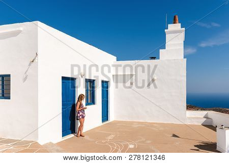 Young Woman Enjoying Holidays In Greece. Sifnos Island, Cyclades, Greece