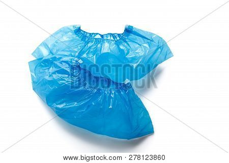 Two Blue Medical Shoe Covers For Feet Isolated On White Background. Hygiene And Cleanliness In Healt