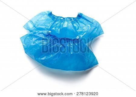 Two Blue Medical Shoe Covers For Feet Isolated On White Background. Hygiene And Cleanliness In Healt