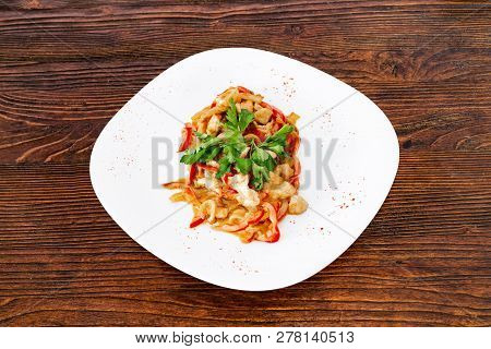 Chicken Fricassee With Mushrooms On A White Plate With Vegetables Top View Close-up