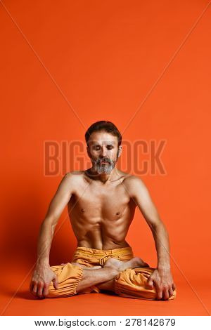 Yoga. Portrait Of Yogi Men Doing Yoga Exercise On Black Mat, He Breath And Performing Upward Abdomin
