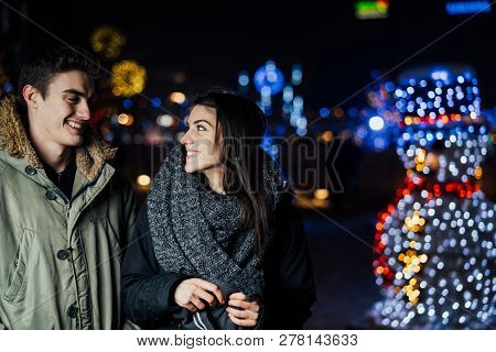 Night Portrait Of A Happy Couple  Smiling Enjoying Winter And Snow Aoutdoors.winter Joy.positive Emo