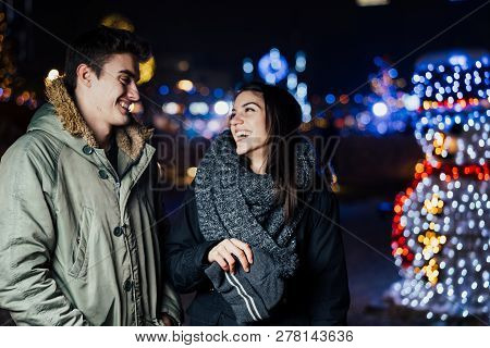 Night Portrait Of A Happy Couple  Smiling Enjoying Winter And Snow Aoutdoors.winter Joy.positive Emo