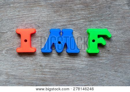 Colorful Plastic Alphabet In Word Imf (abbreviation Of International Monetary Fund) On Wood Backgrou