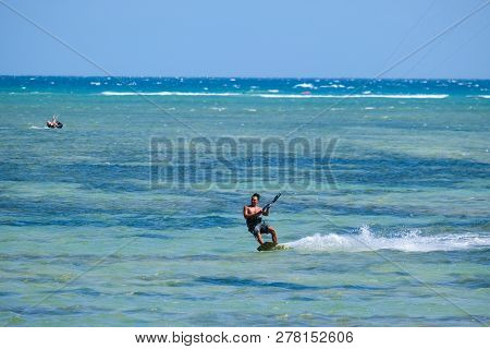 Mui Ne, Vietnam - 05 2019: Kitesurfing, Kiteboarding, Kite Surf. Extreme Sport Kitesurfing In Tropic