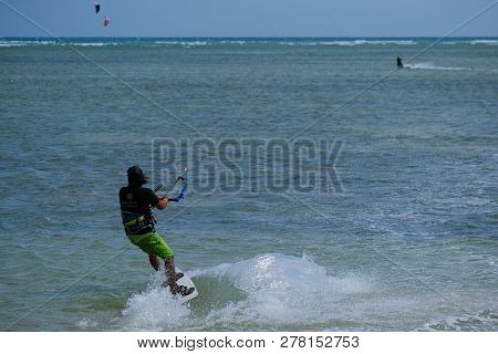 Mui Ne, Vietnam - 11 2018: Kitesurfing, Kiteboarding, Kite Surf. Extreme Sport Kitesurfing In Tropic