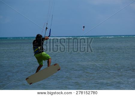 Mui Ne, Vietnam - 11 2018: Kitesurfing, Kiteboarding, Kite Surf. Extreme Sport Kitesurfing In Tropic