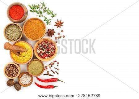 Mix Of Spices In Wooden Bowl Isolated On A White Background With Copy Space For Your Text. Top View.