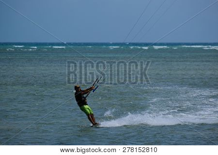 Mui Ne, Vietnam - 11 2018: Kitesurfing, Kiteboarding, Kite Surf. Extreme Sport Kitesurfing In Tropic