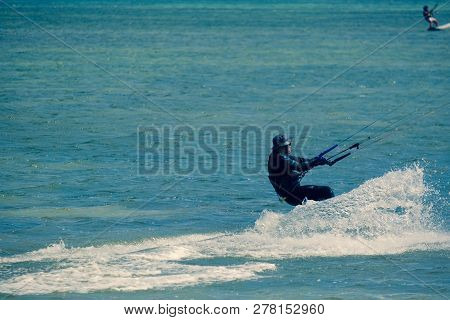 Mui Ne, Vietnam - 11 2018: Kitesurfing, Kiteboarding, Kite Surf. Extreme Sport Kitesurfing In Tropic