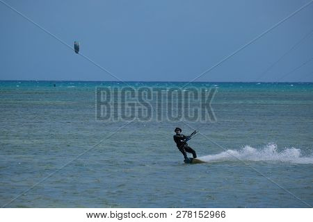 Mui Ne, Vietnam - 11 2018: Kitesurfing, Kiteboarding, Kite Surf. Extreme Sport Kitesurfing In Tropic