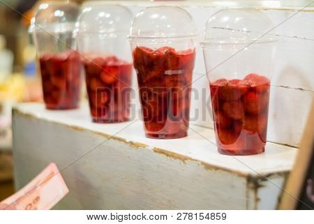 Strawberry And Syrup In The Plastic Glass Show On The Shelf Prepare For Made To Smoothies By The Cus