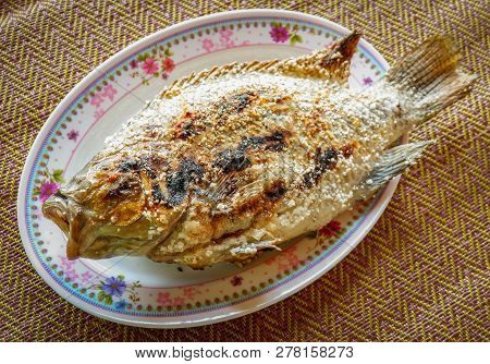 Grilled Fish Tilapia - Cook Tilapia With Salt In Asian Style Food On Plate - Fish Burn Thai Tilapia 