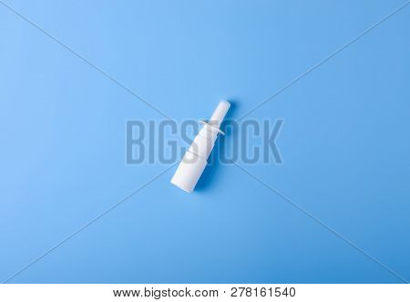 Spray For Nose Nasal On Blue Background, Top View, Medical Pharmacy Concept