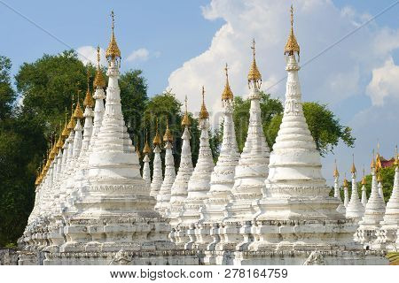 Rows Of The White Stupas Of The Sandamuni Pagoda On A Sunny Afternoon. Mandalay, Myanmar (burma)