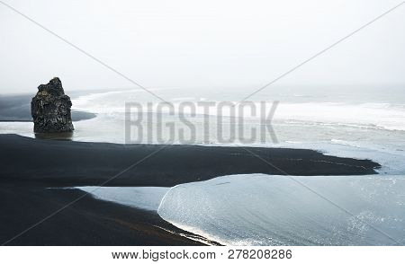 Reynisfjara Beach With Black Volcanic Sand In Southern Iceland