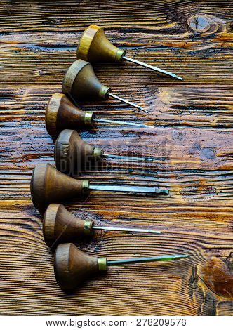 Different Gravers For Jewelry On A Wooden Background