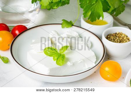 Fresh Greek Feta Cheese In A Bowl Whole And Slices For Salad With Vegetables
